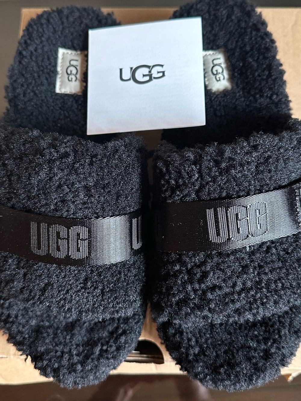 Ugg Fluffita Slides. Brand new, never worn. Size 7 Black. In original box